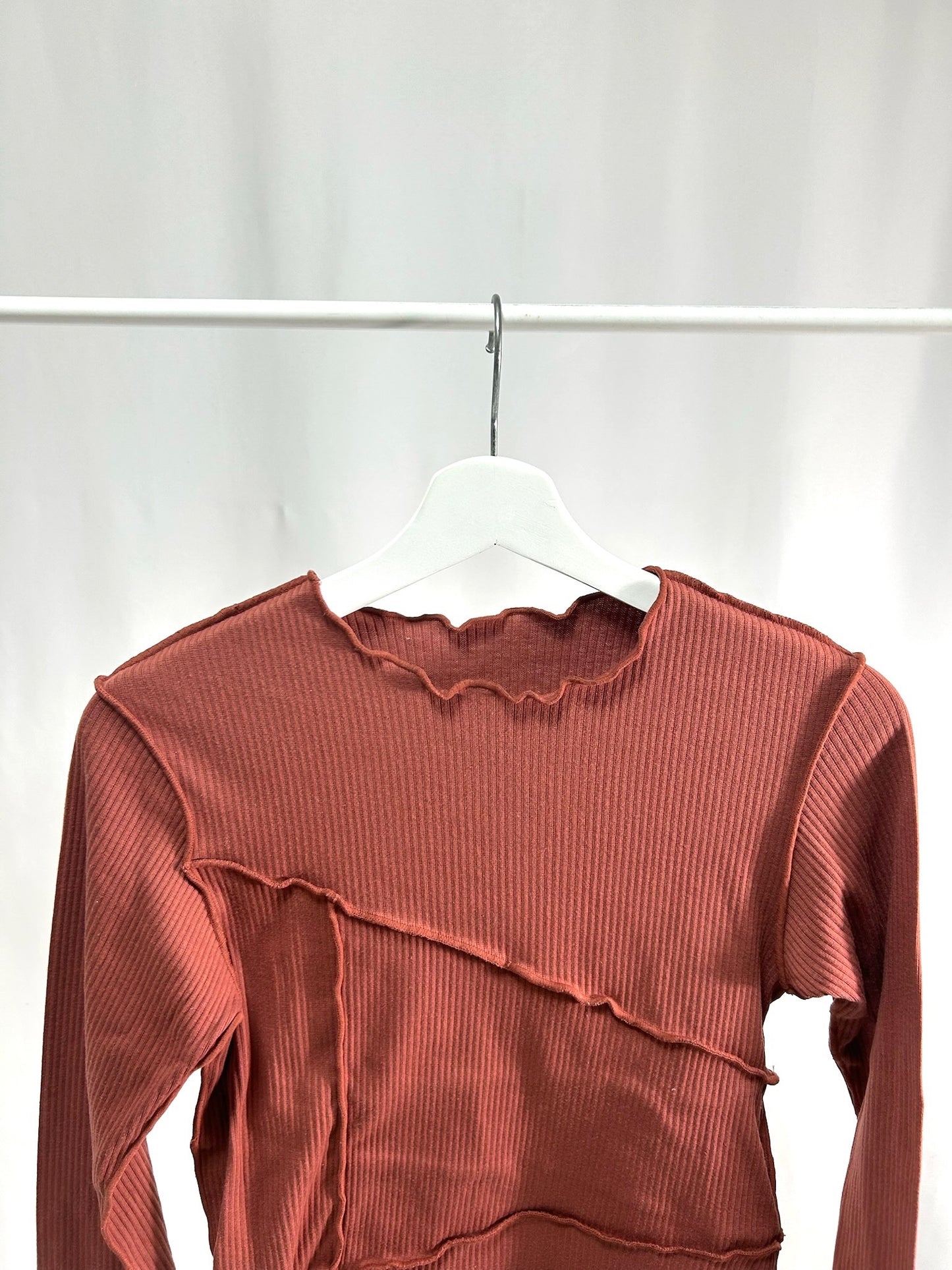 25019Dusty Red Lettuce Hem Top