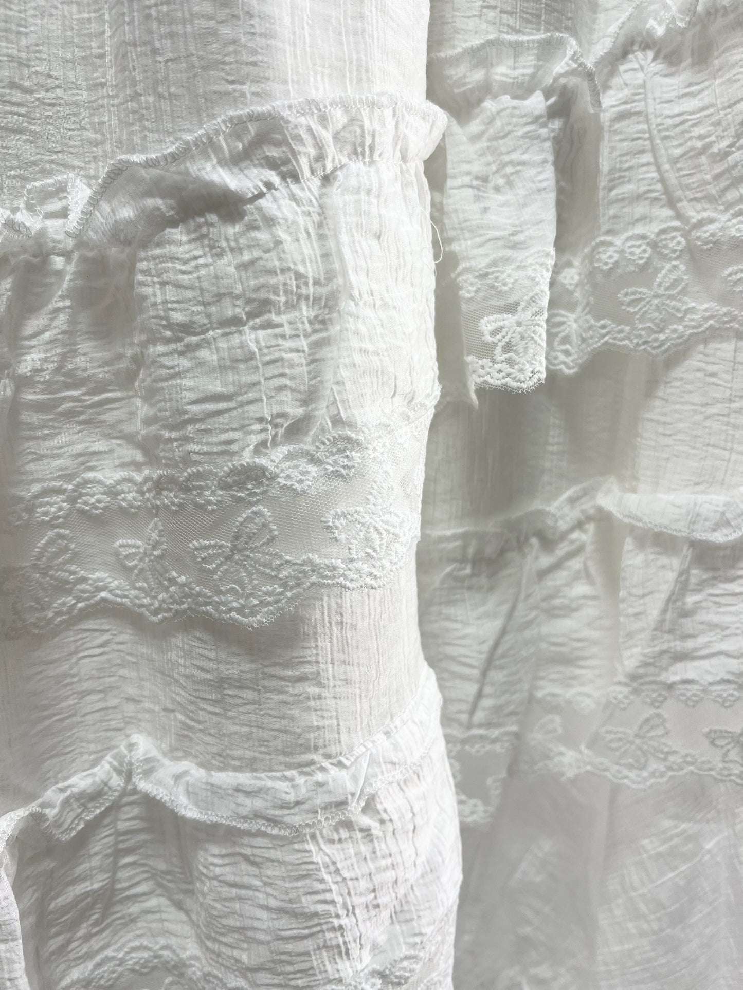 25000011White Lace Skirt – Midi Length