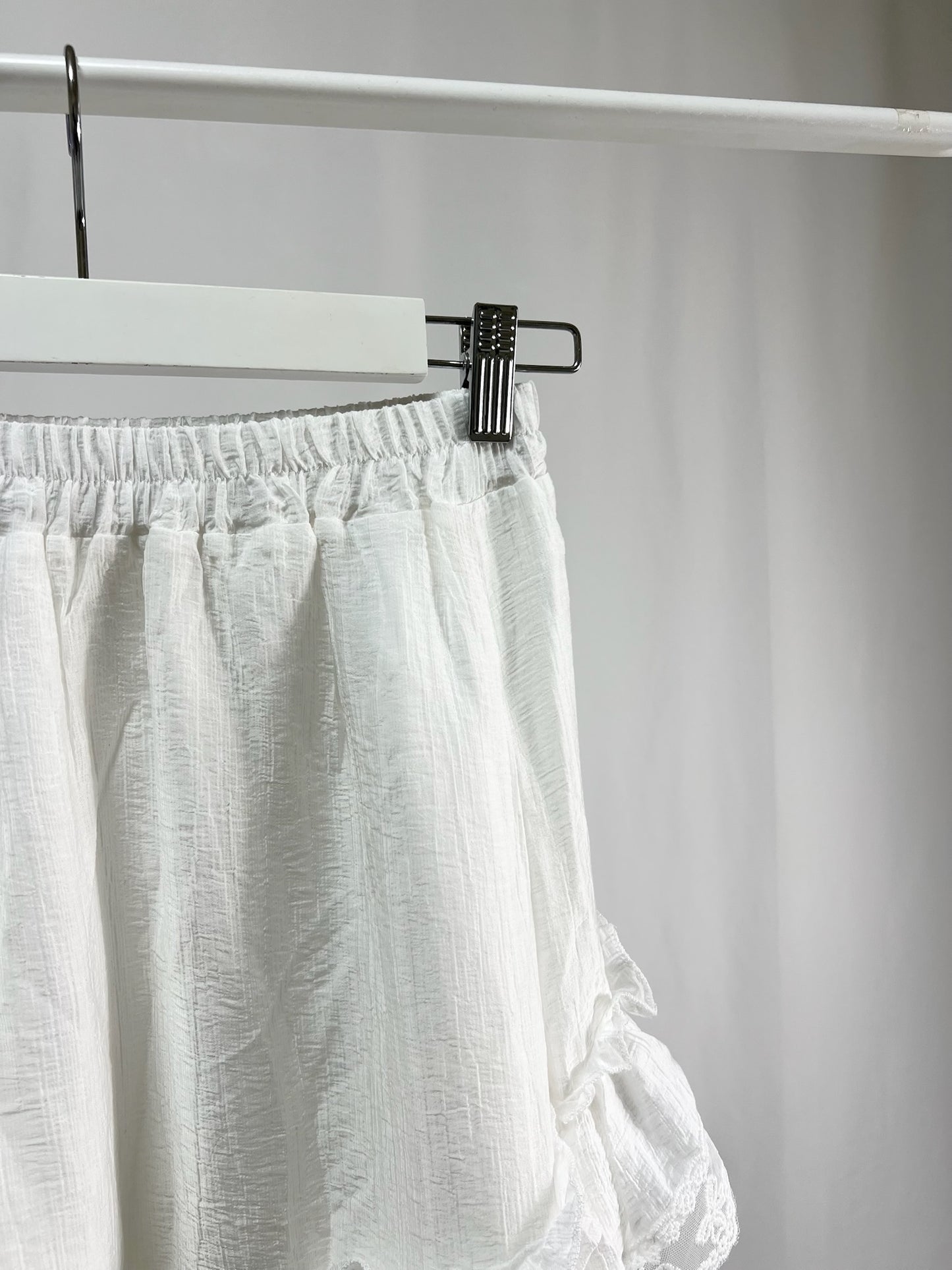 25000011White Lace Skirt – Midi Length