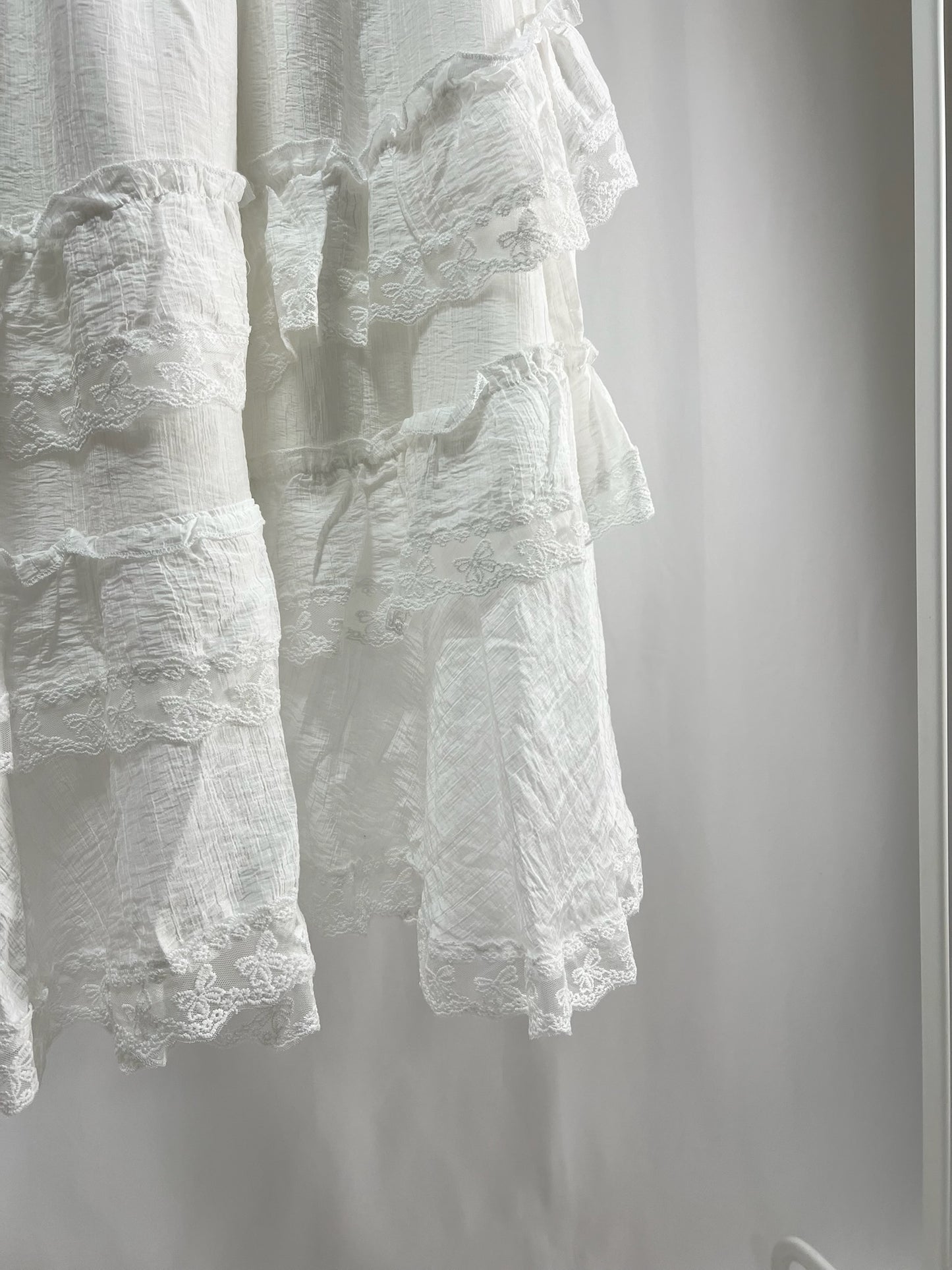 25000011White Lace Skirt – Midi Length