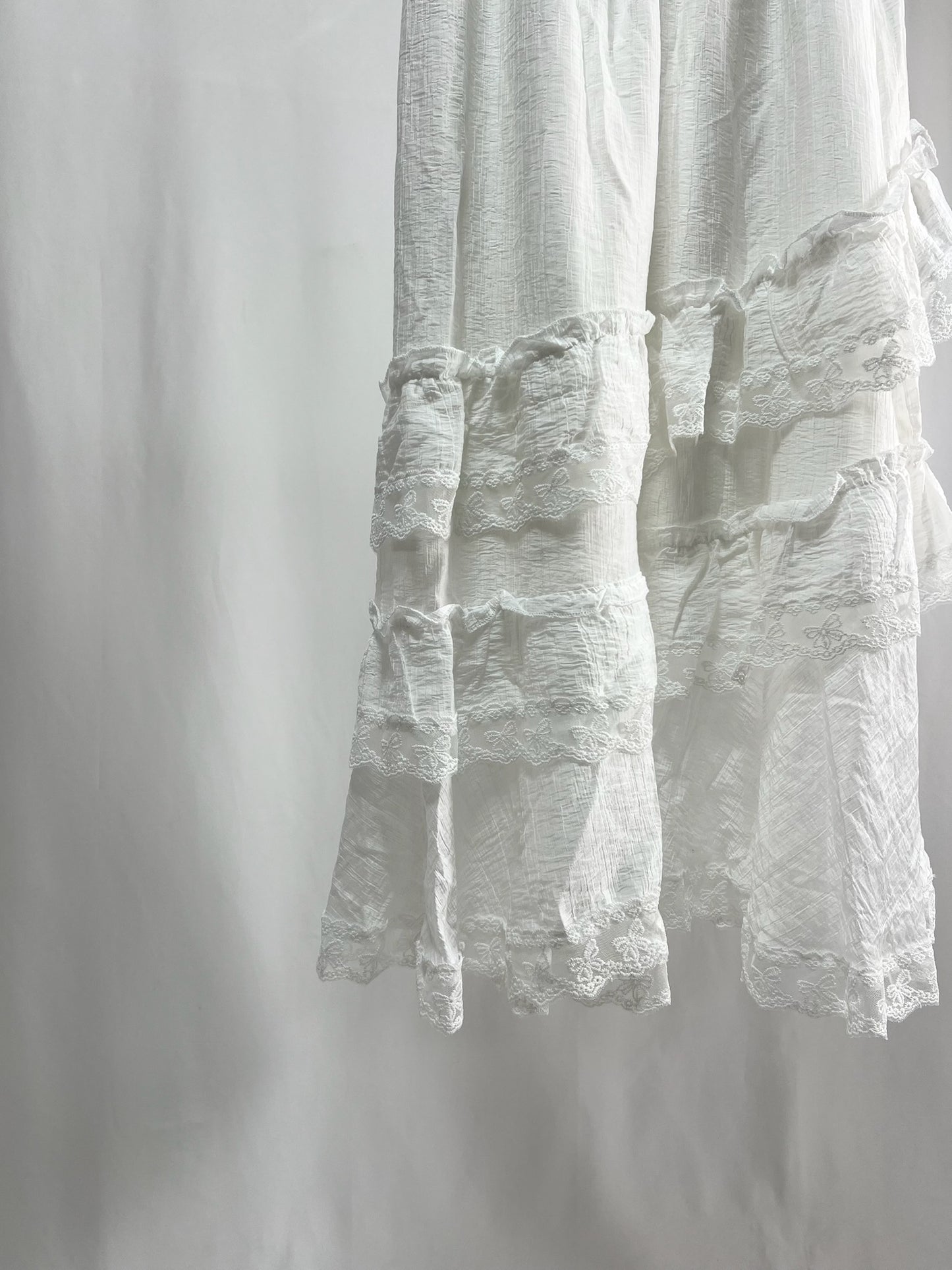 25000011White Lace Skirt – Midi Length