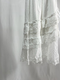 25000011White Lace Skirt – Midi Length