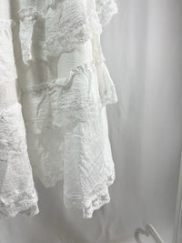 25000011White Lace Skirt – Midi Length