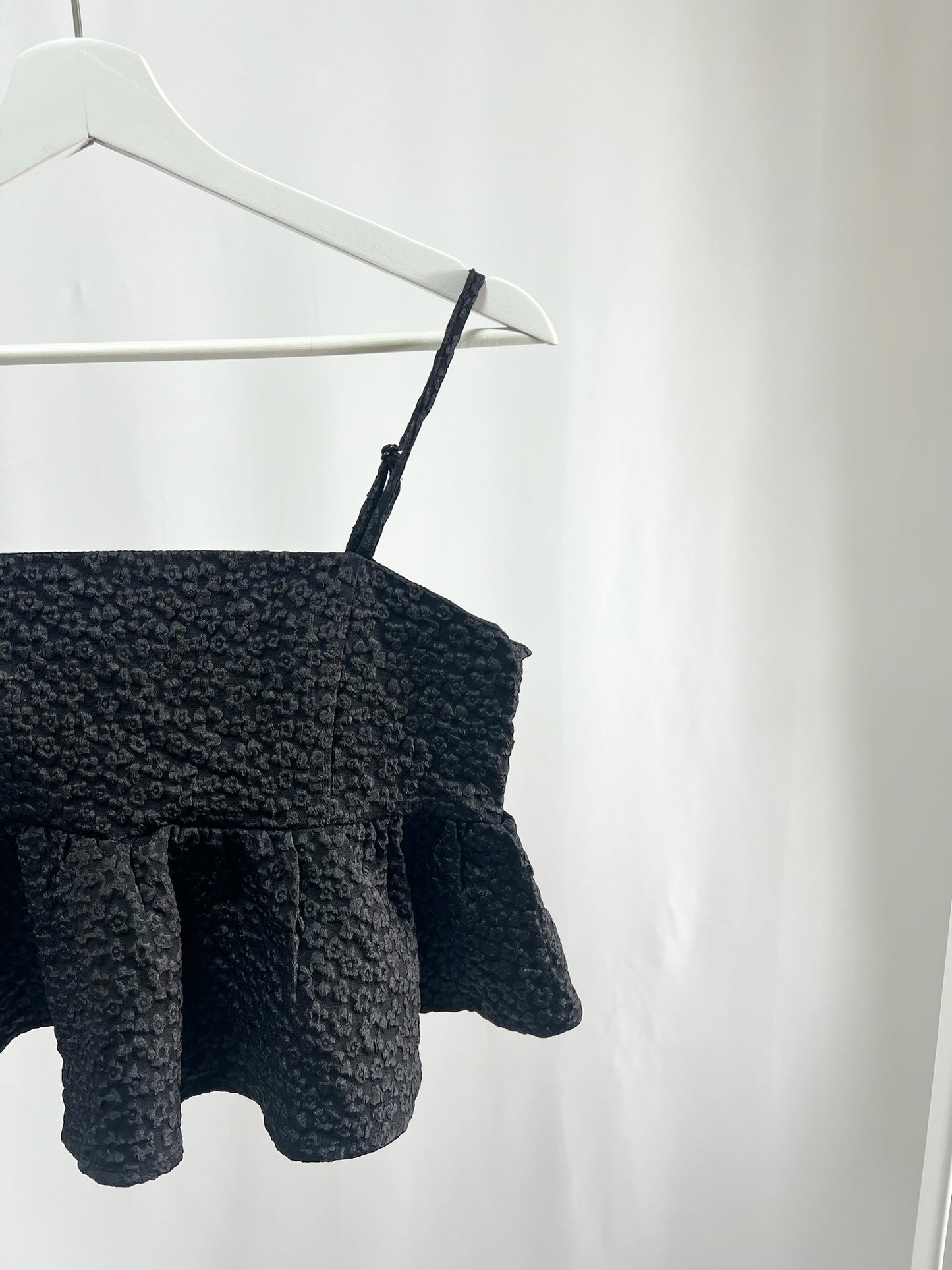 25036Textured Peplum Camisole